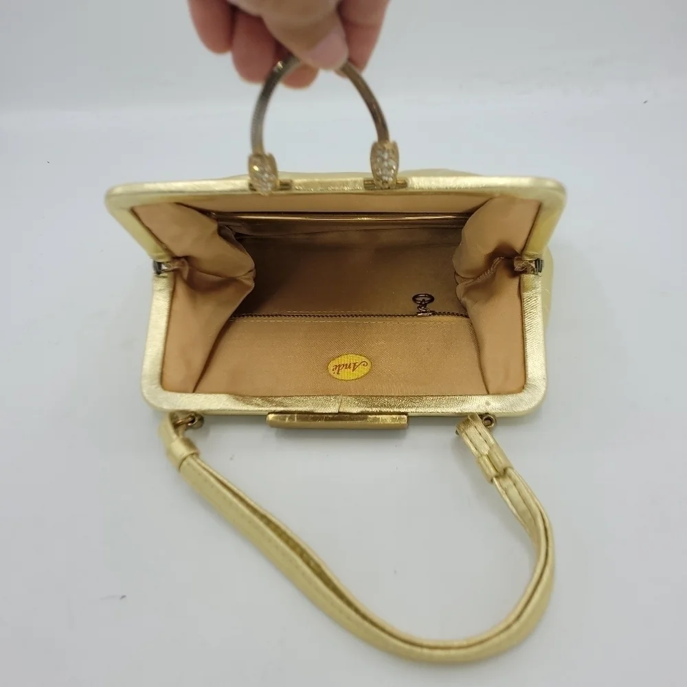 Vintage Andé Gold Clutch With Rhinestone Details Clasp.